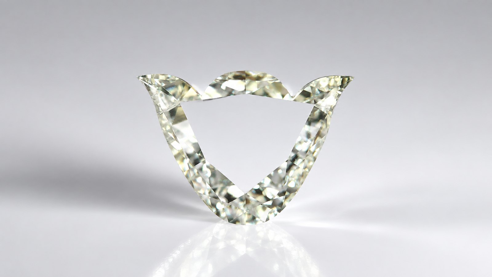 A chevron-cut fancy yellow diamond